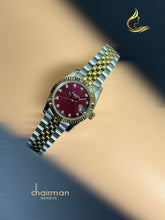 ساعة نسائية من Chairman Geneve باللون الكستنائي ومينا مؤرخة وسلسلة فضية وذهبية